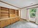 Living room featuring built-in shelving and a bright window with natural light at 220 Lakeview Dr, Belmont, NC 28012