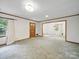 Bright and airy living room featuring a large window and neutral carpet at 220 Lakeview Dr, Belmont, NC 28012