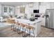 Bright kitchen with white cabinets, stainless steel appliances, and a large island with bar seating at 2485 Hedgecliff Rd, Kannapolis, NC 28025