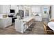 Modern kitchen featuring white cabinets, stainless steel appliances, and an island with seating at 2485 Hedgecliff Rd, Kannapolis, NC 28025