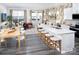 Open concept kitchen and dining area features an island with bar seating and stainless steel appliances at 3095 Big Bend Dr, Kannapolis, NC 28025