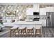 Modern kitchen with white cabinets, stainless steel appliances, and a center island with bar stools at 3095 Big Bend Dr, Kannapolis, NC 28025