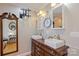 A neutral-toned bathroom featuring double vanity, white sinks, wood cabinets, and contemporary lighting at 3500 Sunningdale Ln # 221, Statesville, NC 28625