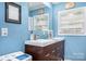 Bright bathroom with double sinks, modern fixtures, and a fresh color scheme at 3500 Sunningdale Ln # 221, Statesville, NC 28625