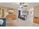 Cozy bedroom showcasing natural light, ceiling fan, warm beige walls and carpet at 3500 Sunningdale Ln # 221, Statesville, NC 28625