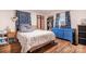 Comfortable bedroom with wood floors and blue accents at 3500 Sunningdale Ln # 221, Statesville, NC 28625