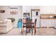 Eat-in kitchen featuring white cabinets, stainless appliances, and a table with seating at 3500 Sunningdale Ln # 221, Statesville, NC 28625