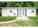 Charming home featuring a welcoming front door and white siding and a manicured lawn at 3500 Sunningdale Ln # 221, Statesville, NC 28625
