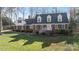 Well-maintained brick home with manicured lawn and inviting front entrance with painted white railings at 3500 Sunningdale Ln # 221, Statesville, NC 28625