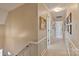 Hallway with white wainscoting and neutral paint, connecting various rooms on the upper level at 3500 Sunningdale Ln # 221, Statesville, NC 28625