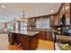 Open kitchen featuring granite countertops, stainless steel appliances, and hardwood floors at 3500 Sunningdale Ln # 221, Statesville, NC 28625