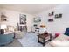 Cozy living room with blue rug, comfortable seating, and bookshelves at 3500 Sunningdale Ln # 221, Statesville, NC 28625