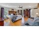 A spacious main bedroom is filled with natural light, hardwood floors, and stylish furnishings at 3500 Sunningdale Ln # 221, Statesville, NC 28625