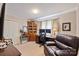 Comfortable home office with desk, leather chair, and natural light for a productive workspace at 3500 Sunningdale Ln # 221, Statesville, NC 28625