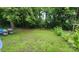 Spacious backyard featuring a lush green lawn with mature trees at 3715 Patricia Nw Dr, Concord, NC 28027