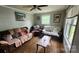 Cozy living room with hardwood floors, comfortable seating, and ample natural light at 3715 Patricia Nw Dr, Concord, NC 28027