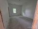 Empty bedroom featuring an unfinished floor, offering a blank canvas for new homeowners to design at 38 Holly St, Great Falls, SC 29055