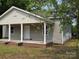 Charming home with a welcoming front porch, showcasing its inviting facade and curb appeal at 38 Holly St, Great Falls, SC 29055