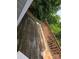 Exterior view of an old deck with weathered wood and failing supports in need of replacement or repair at 38 Holly St, Great Falls, SC 29055