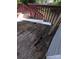 Backyard deck in need of replacement showing the wood deck boards with holes and rotten wood at 38 Holly St, Great Falls, SC 29055