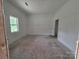 Unfinished room with a window, providing natural light and awaiting personalization and finishing touches at 38 Holly St, Great Falls, SC 29055