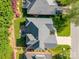 Aerial view of a well-maintained home with a large backyard, patio, and mature landscaping at 4004 Saint Andrews Ct, Cramerton, NC 28032