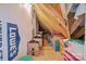 Unfinished attic featuring exposed wooden beams, boxes, and storage for organizational needs at 4004 Saint Andrews Ct, Cramerton, NC 28032
