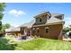 Landscaped backyard with a patio, BBQ grill, and outdoor furniture, perfect for outdoor entertaining at 4004 Saint Andrews Ct, Cramerton, NC 28032