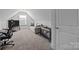 Comfortable bedroom features plush carpet, a cozy couch, and plenty of natural light at 4004 Saint Andrews Ct, Cramerton, NC 28032