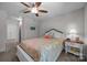 Bedroom with white trim, plush carpet, ceiling fan, and large window providing natural light at 4004 Saint Andrews Ct, Cramerton, NC 28032