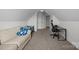 Neutral bedroom boasts plush carpeting, a couch, desk, and ample space for relaxation or work at 4004 Saint Andrews Ct, Cramerton, NC 28032