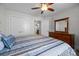 Bedroom with view of closet and ensuite bathroom featuring carpet and dark wooden dresser at 4004 Saint Andrews Ct, Cramerton, NC 28032
