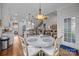 Dining area with chandelier adjacent to kitchen and living room at 4004 Saint Andrews Ct, Cramerton, NC 28032
