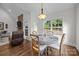 Eat-in dining area features a stone fireplace and lots of natural light at 4004 Saint Andrews Ct, Cramerton, NC 28032