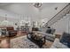Open-concept living room showing view to kitchen and staircase at 4004 Saint Andrews Ct, Cramerton, NC 28032