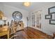 Inviting office with hardwood floors, large mirror wall decor and ample natural light at 4004 Saint Andrews Ct, Cramerton, NC 28032