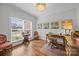 Bright office space with hardwood floors, natural light from a large window, and classic decor at 4004 Saint Andrews Ct, Cramerton, NC 28032