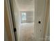View of bedroom with fresh drywall and natural light at 4040 Grommet Ct, Matthews, NC 28105