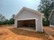 A spacious new construction detached garage with gray siding and white trim provides ample parking and storage at 4040 Grommet Ct, Matthews, NC 28105