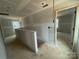 Upstairs hallway featuring a railing and multiple doorframes ready for customization in this new home at 4040 Grommet Ct, Matthews, NC 28105