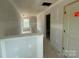 Upstairs hallway featuring a railing and multiple doorframes ready for customization in this new home at 4040 Grommet Ct, Matthews, NC 28105