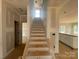 New construction home interior features a staircase and natural light at 4040 Grommet Ct, Matthews, NC 28105