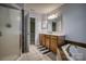 Bathroom featuring a glass shower, wooden vanity, soaking tub with tile surround, tile floors, and neutral walls at 418 Eastway Sw Ln, Conover, NC 28613