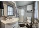Bathroom featuring a corner shower, vanity, and gray walls at 418 Eastway Sw Ln, Conover, NC 28613