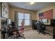 Spacious bedroom with two desks, modern gaming chairs, natural light and American flag at 418 Eastway Sw Ln, Conover, NC 28613