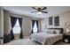 Calming bedroom with neutral tones, a ceiling fan, and cozy decor elements at 418 Eastway Sw Ln, Conover, NC 28613