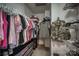 Organized walk-in closet with hanging racks, shelving and storage drawers for maximum clothing and personal item space at 418 Eastway Sw Ln, Conover, NC 28613