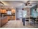 Eat-in kitchen features tile floors, stainless appliances, and a modern ceiling fan at 418 Eastway Sw Ln, Conover, NC 28613