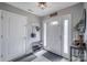 Bright entryway with neutral walls, shoe rack, coat rack and decor provides a welcoming first impression at 418 Eastway Sw Ln, Conover, NC 28613