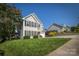 Beautifully landscaped home with a lush green lawn, complementing the well-maintained neighborhood at 418 Eastway Sw Ln, Conover, NC 28613